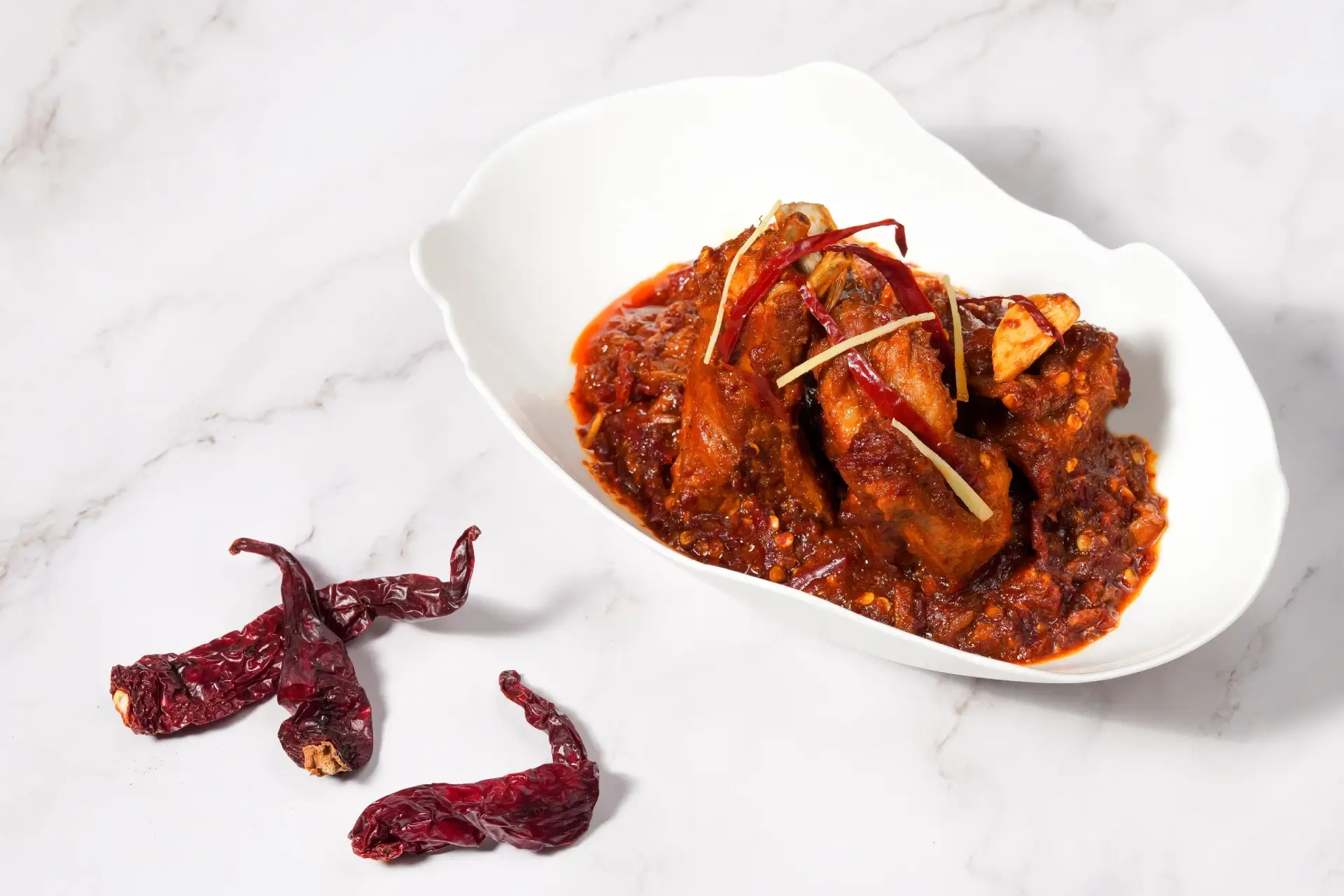 Spicy Indian chicken dish with dried red chillies and ginger at Food Exchange Aerocity Delhi