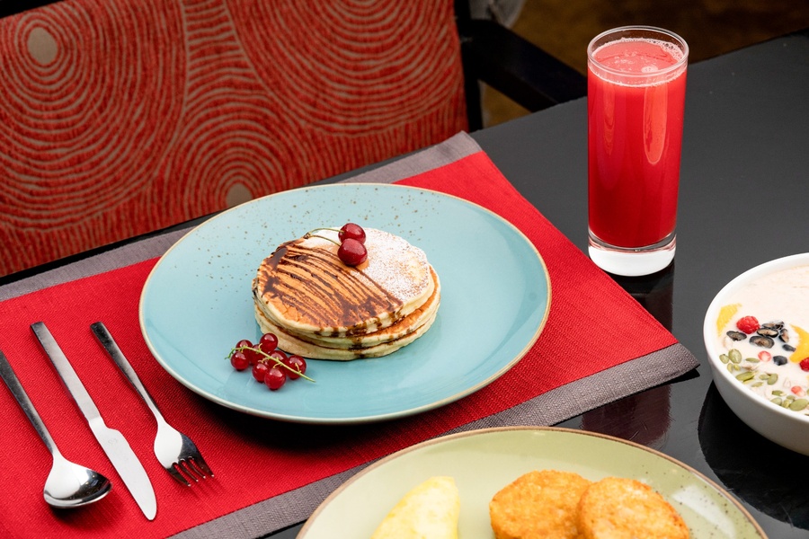 Pancakes with fresh berries and juice at Food Exchange Aerocity Delhi